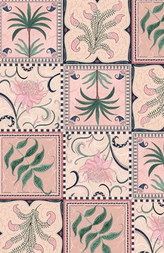 a pink and green tile with flowers on it