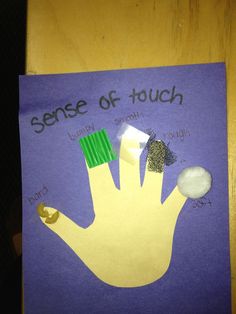 a piece of paper that says sense of touch with an image of a hand on it