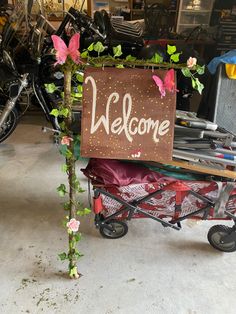 a welcome sign sitting on top of a cart