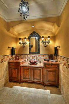 a bathroom with two sinks and a large mirror