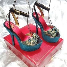 Condition: - New In Box! / Box Has Light Wear - Really High And Really Hot! - Turquoise Blue Platform With A Green Peacock Print And Black Straps Size: 7.5 Material: Man Made Name: Jenny Measurements: - 6.5" Heel - 2.5" Platform Turquoise Open Toe Sandals For Party, Turquoise Ankle Strap Heels For Party, Turquoise Open Toe Heels For Formal Occasions, Turquoise Open Toe Heels For Formal Events, Elegant Turquoise Heels For Party, Formal Turquoise Open Toe Heels, Elegant Turquoise Party Heels, Blue Party Sandals With Removable Insole, Turquoise Heels For Party