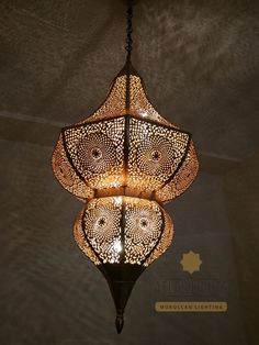 an intricately designed chandelier hangs from the ceiling