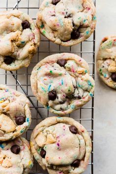 cookies with chocolate chips and sprinkles on a cooling rack, ready to be eaten