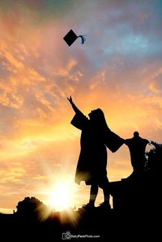 two people are flying a kite in the sky at sunset or dawn, while the sun is low to the ground