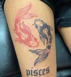 a woman with a tattoo on her leg that says pisces and two koi fish