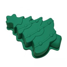 three pieces of green plastic sitting on top of each other