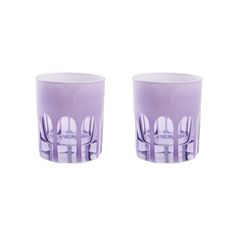 two purple glass cups sitting next to each other