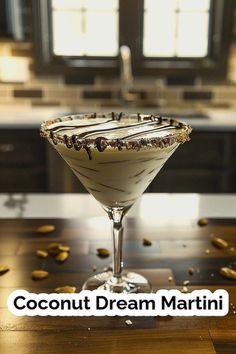 a martini glass filled with cream and chocolate