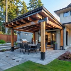 a covered patio with table and chairs on it