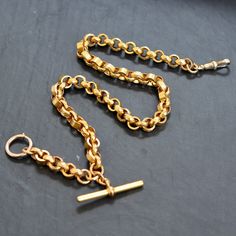 9ct Yellow gold watch chain with fancy round links and a pattern to the outer surface of many of the links. A very stylish and unique watch chain. Circa 1890. Weight   35.6 grams Length of chain 40.5 cm Width of Links:  7.95 mm Each and every piece listed by Vintage Fine Jewellery has been restored by hand in our London workshop by highly skilled jewellers. Our jewellers use the same expertise to restore a piece of jewellery, as were used in their creation many years ago. If you would like to se Vintage Yellow Gold Curb Chain Bracelet, Vintage Chain Bracelet With Curb Chain Link, Vintage Yellow Gold Chain Bracelet, Vintage Yellow Gold Oval Link Chain Bracelet, Antique Chain Bracelet For Formal Occasions, Victorian Gold Jewelry With Hooks And Links, Formal Engraved Link Chain Necklace, Vintage Oval Link Curb Chain Necklace, Vintage Gold Engraved Chain Bracelet