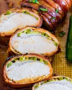 several slices of bacon wrapped in bread next to a green pepper