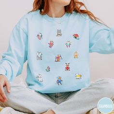 Get ready to hit the slopes in adorable style with our Skiing Comfort Colors Sweatshirt! This winter wonder showcases cute little animals hitting the slopes, adding a whimsical touch to your skiing adventures. Made from soft and cozy fabric, this sweatshirt is perfect for showcasing your love for both winter sports and charming critters. Embrace the snowy vibes with our playful and stylish Skiing Comfort Colors Sweatshirt - where cute meets comfort on the slopes! Luxurious comfort and style are what this unisex, garment-dyed sweatshirt is all about. It's made with 80% ring-spun cotton and 20% polyester and the fabric is 3-end garment-dyed, ring-spun, color-blast fleece with a 100% cotton face. Each sweatshirt comes with a relaxed fit, a rolled-forward shoulder, and a back neck patch.  .: 8 Playful Relaxed Fit Winter Tops, Playful Relaxed Fit Tops For Winter, Playful Crew Neck Hoodie For Winter, Playful Winter Crew Neck Sweatshirt, Playful Crew Neck Winter Sweatshirt, Fun Blue Crew Neck Sweatshirt, Fun Winter Crew Neck Sweatshirt, Fun Crew Neck Winter Sweatshirt, Snowy Vibes