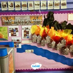 a bulletin board with flowers on it in the middle of a school classroom room,