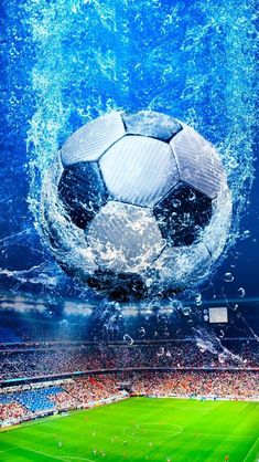 a soccer ball is in the air with water splashing over it