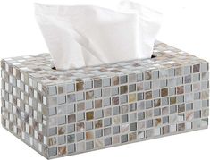 a tissue box that is made out of mosaic tiles and has two tissues in it