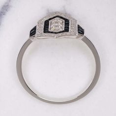 This gorgeous vintage inspired diamond and onyx cocktail ring truly captures the iconically stylish aesthetic of the Art Deco era! The chic geometric design glitters with vibrant diamonds and is punctuated by striking lines of meticulously custom cut onyx. The effect is striking, gorgeously sophisticated, and eternally stylish! Whether you are buying for yourself or a special someone, this beauty is sure to delight!The diamonds are brilliantly white, graded G-H for color. Graded SI1 for clarity, Onyx Engagement Ring Vintage, Saturated Blue, Onyx Engagement Ring, Art Deco Geometric, Stylish Aesthetic, Chic Art, Vintage Style Rings, Ring Art Deco, Wide Rings