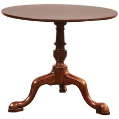 a wooden table with an oval top