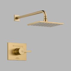 an overhead shower head with thermostaer and hand showerhead in polished brass