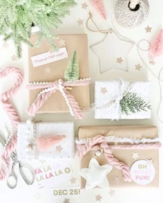 presents wrapped in brown paper and tied with pink twine, pine tree decoration on top