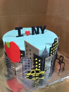 a cake that has been decorated with the words i love ny and an apple on it