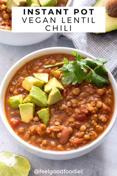 two bowls of instant pot vegan lentil chili with avocado and cilantro