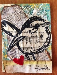 an altered piece of paper with a bird on it and a red heart in the middle