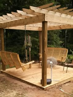 a wooden deck with chairs and an air conditioner