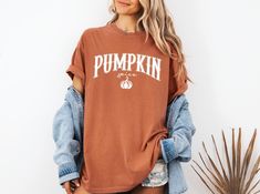 Retro Pumpkin Spice T-Shirt, Pumpkin T-Shirt, Thanksgiving Shirt, Autumn Vibes, Thankful Tee, Halloween Tee, Trend Fall Tee, Cozy Fall Tee, Comfort Colors ❤Welcome to Capellaa Designs,  If you are looking for clothes that suit your pleasure, you are in the right place! I would really like to offer you the best products. I love my job and are happy to offer you quality products. If you have any questions, concerns or requests regarding my products, feel free to ask me. This is my job and you can be sure that we will get back to you as soon as possible. ❤Sizing and Coloring When choosing the product, please pay attention to the size and color. In this way, I can deliver it to you in a shorter time. ❤Product Details Unisex T-Shirt: - Comfort Colors Brand -100% cotton ❤Shipping  After placing Fall Fan Apparel T-shirt With Graphic Print, Fan Apparel Graphic T-shirt For Fall, Fan Apparel Graphic Print T-shirt For Fall, Retro Pumpkin, Products I Love, Fall Tee, Thanksgiving Shirt, Autumn Vibes, Thanksgiving Shirts