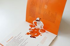 an orange and white brochure with a cartoon chef on it's back