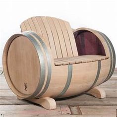 a wooden barrel chair sitting on top of a wooden floor