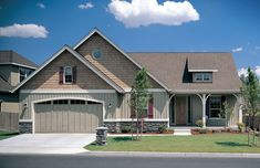 a large house with two garages on each side