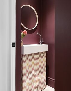 a bathroom with a sink and mirror on the wall next to an open closet door