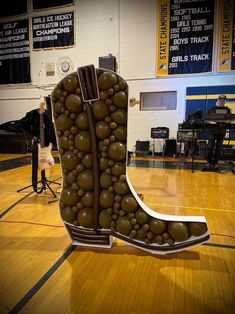 a pair of boots made out of balls on a basketball court