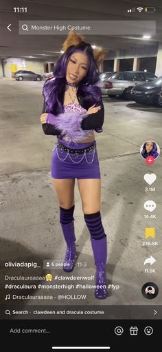 a woman in purple is standing on the street with her arms crossed and legs spread out