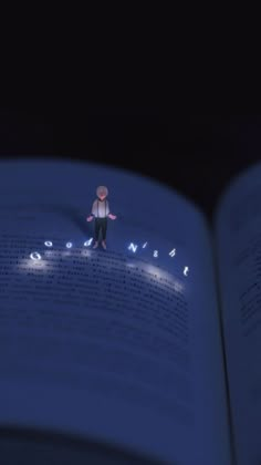 an open book with a person standing on top of it in the middle of pages