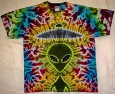 an alien t - shirt is shown on a white background with multicolored tie dye