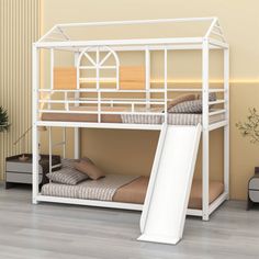 a white bunk bed with a slide next to it on the floor in a room