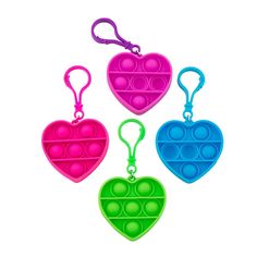 three heart shaped plastic key chains are shown in different colors and shapes, one is pink, the other is blue