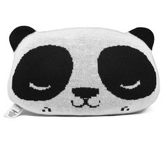 a black and white panda bear purse with eyes closed