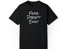 F(alse) E(vidence) A(ppearing) R(eal). If you examine your fears closely, you'll realize they are created in your mind to keep you safe. Take risks! Pursue your dream life!  *All garments are professionally pressed using Direct-to-Garment (DTG) and are made to last! *All shirts are Unisex sizing. Order a size larger for an "oversized" fit. Review the shirt measurements to confirm.  Comfort Colors Unisex Tees:  .: 100% US cotton that is ethically grown and harvested. .: Medium fabric, pre-shrunk cotton for size retention. .: Relaxed, slightly oversized fit that is comfy in both casual and semi-formal settings. .: Double-needle stitching throughout the tee for high durability. .: Crew neckline delivers a classic, neat style which makes it perfect for accessorizing. Visit our website thehighe Meditation Gifts, Take Risks, Spiritual Gifts, Neat Style, Gifts For Men, Semi Formal, Oversized Fits, Dream Life, Comfort Colors