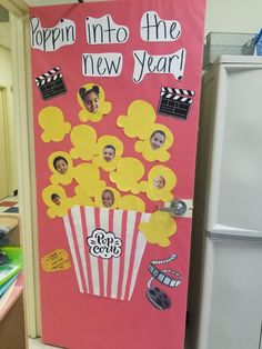 a pink door decorated with pictures and popcorn