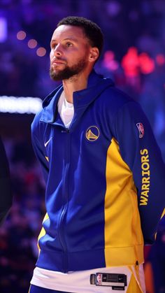 the golden state warriors'stephen curry looks on from the sidelines