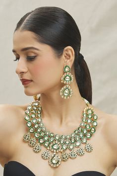 14kt gold plated green necklace made with semi-precious kundan stone embellishments. Comes with a matching pair of earrings. - Aza Fashions Green Emerald Kundan Necklace With Gemstones, Festive Green Jewelry With 17 Jewels, Festive Green Emerald Necklace With Jewels, Green Jeweled Jewelry For Reception, Festive Green Emerald Jeweled Necklace, Festive Green Emerald Necklace, Green Kundan Jewelry With Jewels, Green Kundan Necklace With Gemstone, Hand Set Green Kundan Necklace