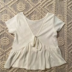 Light And Super Cute/Flowy Top. Never Worn- A Bit Too Big Bundle All Tanks/Tops- 2 For 12 3 For 20 4 For 30 Off White V-neck Top For Day Out, Off White Cotton V-neck Top, Off White Short Sleeve Tops For Spring, Tie T Shirt, Tied T Shirt, Tanks Tops, Flowy Top, White Tie, Flowy Tops