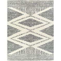 a black and white rug with lines on the bottom, in different shades of grey