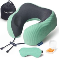 an inflatable travel pillow and sleeping mask are on the table next to it