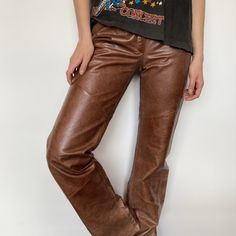 "VINTAGE :: 70s Bootcut Style Leather Jim Morrison Pants  COLOUR :: Brown / Tan  FIT/TAG :: 4 - Best fit S-M / 8 or 9 Aus Womens MATERIAL :: 100% Leather Outer / Poly Satin Lining  CONDITION :: Good MEASUREMENTS ::   Waist - 34cm // 13.25\"   Hips - 44.5cm // 17.5\"  Rise - 22cm // 8.5\"   Outer Leg Length - 111cm // 43.75\"    DETAILS :: Amazing style sample, 70s Jim Morrison vibes. Leather has small amount of wear, fine scratches, overall great vintage condition. Full length leg with raw cut hem. NOTE :: Each hand selected vintage or preloved piece is a one-of-a-kind item & can only be purchased by a single customer. Measurements are in cm/inches lying flat (double width for circumference). Any major details, features or flaws will be described or photographed. POLICY :: Please ask any q Jim Morrison, Vintage 70s, Full Length, Overalls, Adult Outfits, Trousers, Pants, Leather, How To Wear