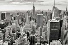 black and white photograph of new york city from the top of the empire state building