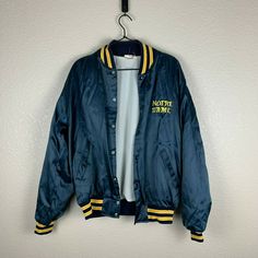 Vintage Notre Dame Varsity Bomber Jacket. Pre-owned. Fits like a small-medium. Inside tag was removed before but I wear medium usually and this is smaller than normal mediums. Blue Track Jacket With Pockets For College, Urban Style Blue Outerwear For College, Blue Hooded College Style Outerwear, Blue College Style Outerwear For School, Blue Urban Outerwear For College, Blue Long Sleeve College Style Outerwear, Blue Cotton Outerwear For School, Casual Navy Outerwear With Letter Print, Casual Blue Varsity Jacket For Outdoor