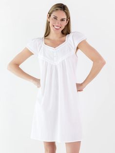 The Valerie Nightgown, a divine combination of elegance and charm, features 3 decorative buttons down the front and its adorable short sleeves are adorned with beautiful lace trim. It exudes feminine and grace and is a great style for every season of the year. Elegant Short Sleeve Sleepwear For Wedding Night, Elegant Short Sleeve Nightgown For Bedtime, Summer Wedding Night Short Sleeve Sleepwear, Elegant Nightgown With Lace Trim For Home, Elegant Short Sleeve Nightgown For Loungewear, Elegant Short Sleeve Nightgown, White Short Sleeve Nightgown For Sleep, Feminine Short Sleeve Dress For Sleepover, White Short Sleeve Dress For Night